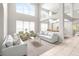 Open-concept living room with soaring ceilings, abundant natural light, and stylish, comfortable furnishings at 5931 Cherry Oak Dr, Valrico, FL 33596