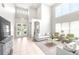 Spacious living room with high ceilings, large windows, and neutral decor for a comfortable ambiance at 5931 Cherry Oak Dr, Valrico, FL 33596