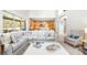 Bright living room with an open floor plan, island kitchen, and large windows to the lanai at 5931 Cherry Oak Dr, Valrico, FL 33596