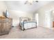Spacious main bedroom with a ceiling fan and an ensuite bathroom entrance at 5931 Cherry Oak Dr, Valrico, FL 33596