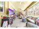 Spacious outdoor patio includes seating, a dining table, a ceiling fan, and sliding glass doors at 5931 Cherry Oak Dr, Valrico, FL 33596