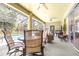 Spacious outdoor patio includes seating, a dining table, a ceiling fan, and sliding glass doors at 5931 Cherry Oak Dr, Valrico, FL 33596
