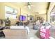 Spacious outdoor patio includes seating, a dining table, a ceiling fan, and sliding glass doors at 5931 Cherry Oak Dr, Valrico, FL 33596