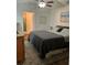 Cozy bedroom with a ceiling fan, a comfortable bed, and a peaceful atmosphere at 6905 Summer Harbor Ln, Riverview, FL 33578