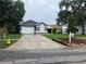 Charming single-story home with a two-car garage, well-manicured lawn, and mature trees at 6905 Summer Harbor Ln, Riverview, FL 33578