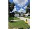 Attractive single-story home with a two-car garage and a vibrant yellow fire hydrant nearby at 6905 Summer Harbor Ln, Riverview, FL 33578