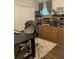 Home office featuring wood flooring, storage cabinets, and ample workspace at 6905 Summer Harbor Ln, Riverview, FL 33578