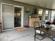 The covered patio features a dining set, outdoor storage, and string lights, creating an inviting space at 6905 Summer Harbor Ln, Riverview, FL 33578