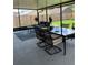 Screened patio with dining table, chairs, and outdoor seating at 6905 Summer Harbor Ln, Riverview, FL 33578