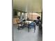 Screened patio with dining table, chairs, and comfortable seating at 6905 Summer Harbor Ln, Riverview, FL 33578