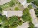 Birds-eye view of the property with mature trees; ample parking space at 8320 High Point Cir # 5, Port Richey, FL 34668
