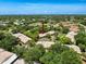 Lovely aerial view of a residential area showcasing well-maintained homes surrounded by mature trees at 8320 High Point Cir # 5, Port Richey, FL 34668