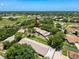 Beautiful aerial view of a residential community with lush green landscaping and nearby water features at 8320 High Point Cir # 5, Port Richey, FL 34668