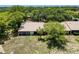 An aerial shot shows the roofline of the single-story villa at 8320 High Point Cir # 5, Port Richey, FL 34668