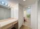 Bathroom boasts ample vanity space, storage cabinets, and a convenient shower at 8320 High Point Cir # 5, Port Richey, FL 34668