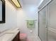Cozy bathroom features shower with glass door, updated vanity and tile flooring at 8320 High Point Cir # 5, Port Richey, FL 34668