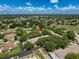 Aerial view of the villa community, showcasing the well-maintained grounds and mature trees at 8320 High Point Cir # 5, Port Richey, FL 34668