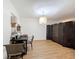 Dining Room with hardwood floors and modern lighting at 8320 High Point Cir # 5, Port Richey, FL 34668