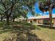 Peaceful community with manicured lawns, mature trees, and well-maintained single story homes at 8320 High Point Cir # 5, Port Richey, FL 34668