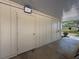 Photo of storage area featuring multiple access doors and exterior lighting at 8320 High Point Cir # 5, Port Richey, FL 34668
