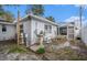 Backyard with pool view from the house, surrounded by greenery and outdoor amenities at 8401 Pinewood St, Tampa, FL 33615