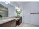 Bathroom featuring dual sinks, a vanity area and granite countertops at 8433 Alberata Vista Dr, Tampa, FL 33647