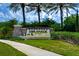 Esplanade of Tampa community entrance sign with lush landscaping, water features, and palm trees at 8433 Alberata Vista Dr, Tampa, FL 33647