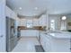 Bright kitchen featuring white cabinets, stainless steel appliances, and granite countertops at 8433 Alberata Vista Dr, Tampa, FL 33647