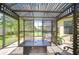 Inviting outdoor living space featuring a pergola, brick flooring, and comfortable seating arrangement at 8433 Alberata Vista Dr, Tampa, FL 33647