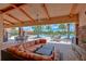 Comfortable outdoor patio with fireplace and lounge seating provides a relaxing space with pool views at 8433 Alberata Vista Dr, Tampa, FL 33647