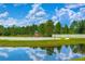Community playground area overlooking pond at 8433 Alberata Vista Dr, Tampa, FL 33647