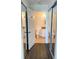 Well-lit bathroom with neutral tones, granite countertop, and mirrored closet doors at 850 S Tamiami Trl # 424, Sarasota, FL 34236