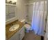 Bathroom featuring a shower with tub, a vanity with a sink, and tile flooring at 850 S Tamiami Trl # 424, Sarasota, FL 34236