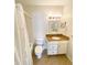 Cozy bathroom with granite countertop, shower, and ample lighting at 850 S Tamiami Trl # 424, Sarasota, FL 34236