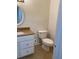 Functional half bathroom showcasing granite counter, white vanity, and modern fixtures at 850 S Tamiami Trl # 424, Sarasota, FL 34236