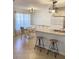 Charming kitchen features granite counters, bar stool seating, and an adjacent dining area with ample natural light at 850 S Tamiami Trl # 424, Sarasota, FL 34236