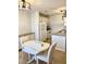 Bright kitchen and dining area, featuring white appliances, granite counters, and a cozy eating nook at 850 S Tamiami Trl # 424, Sarasota, FL 34236