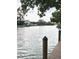 Peaceful waterfront view from a wooden dock overlooking the tranquil canal at 850 S Tamiami Trl # 424, Sarasota, FL 34236