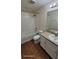 Clean bathroom with a shower-tub combo, white cabinetry, and modern fixtures at 8814 Walnut Gable Ct, Riverview, FL 33578