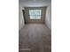 Cozy bedroom featuring plush carpeting and a bright window view at 8814 Walnut Gable Ct, Riverview, FL 33578