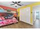 Cheerful bedroom with bunk beds, storage closet, and a ceiling fan at 919 Alpine Dr, Brandon, FL 33510