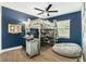 Unique bedroom featuring a loft bed, study area, and beanbag chair at 919 Alpine Dr, Brandon, FL 33510