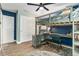 Comfortable bedroom featuring a loft bed, work space, and closet storage at 919 Alpine Dr, Brandon, FL 33510