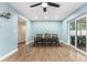 Bright dining room with stylish flooring and natural light from sliding doors at 919 Alpine Dr, Brandon, FL 33510