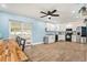 An open-concept kitchen with modern appliances and views of the dining and outdoor patio at 919 Alpine Dr, Brandon, FL 33510