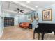 Comfortable living room with tile floors, piano, and guitars hanging on the wall at 919 Alpine Dr, Brandon, FL 33510