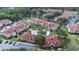 Aerial view of community, highlighting the pool and lush surroundings at 9481 Highland Oak Dr # 1504, Tampa, FL 33647