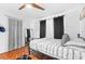 This bedroom features hardwood floors, a full sized bed, and neutral modern design at 9481 Highland Oak Dr # 1504, Tampa, FL 33647