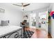 Bedroom featuring wood floors and an adjacent bathroom and kitchen at 9481 Highland Oak Dr # 1504, Tampa, FL 33647