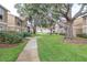 Well maintained complex with mature trees, sidewalks and landscaping at 9481 Highland Oak Dr # 1504, Tampa, FL 33647